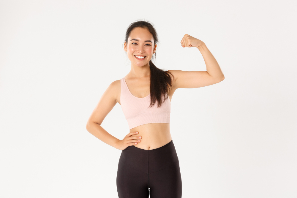 <a href="https://www.freepik.com/free-photo/sport-wellbeing-active-lifestyle-concept-portrait-smiling-slim-strong-asian-fitness-girl-personal-workout-trainer-showing-muscles-flexing-biceps-look-proud-white-background_11162212.htm#query=muscle%20wellness&position=0&from_view=search">Image by benzoix</a> on Freepik